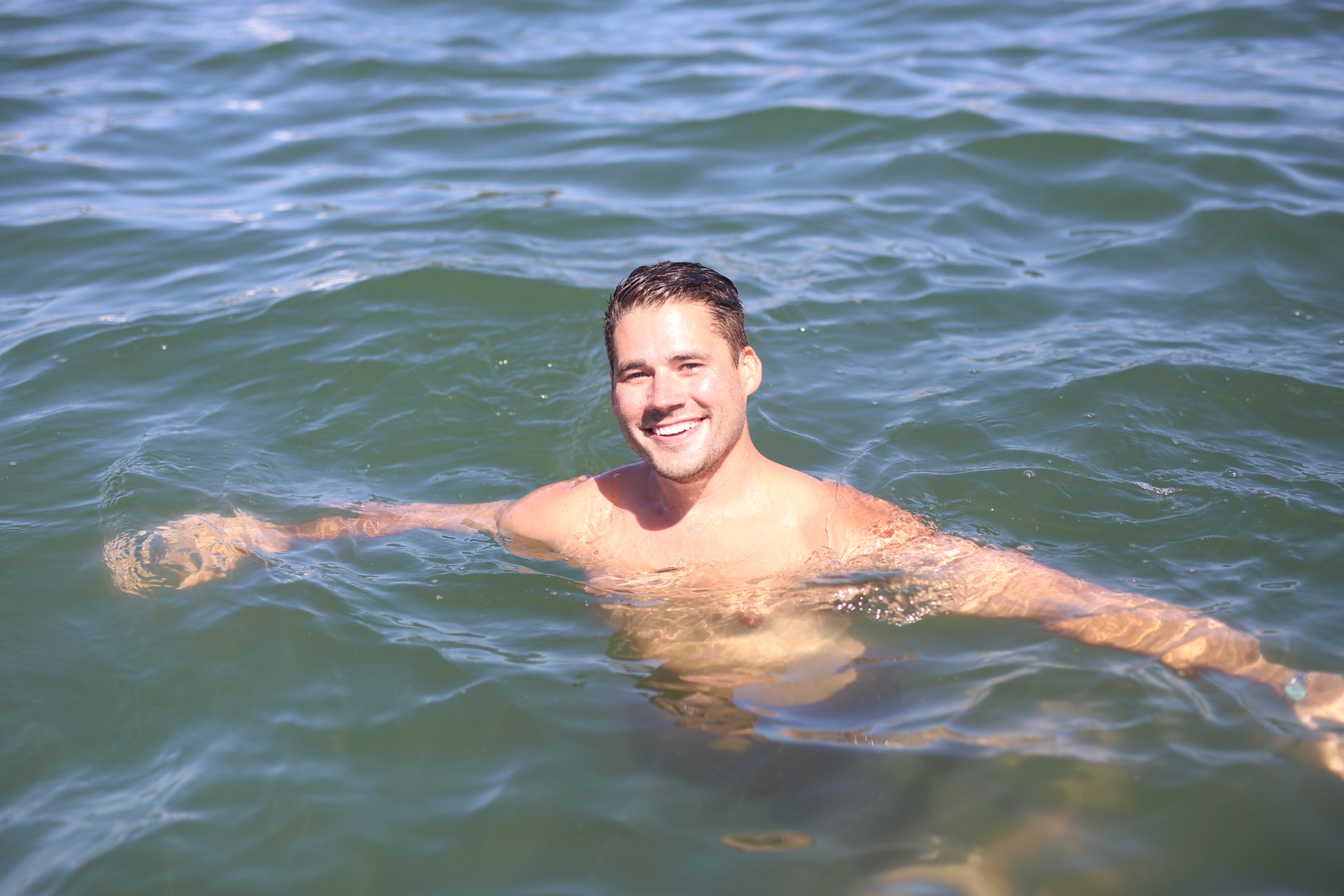 Neil swimming in the ocean